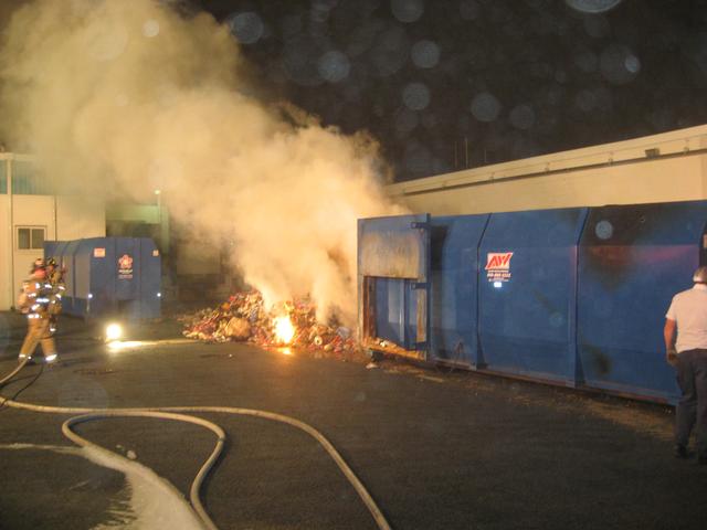 Trash Compactor on fire at Herrs Foods, Inc.